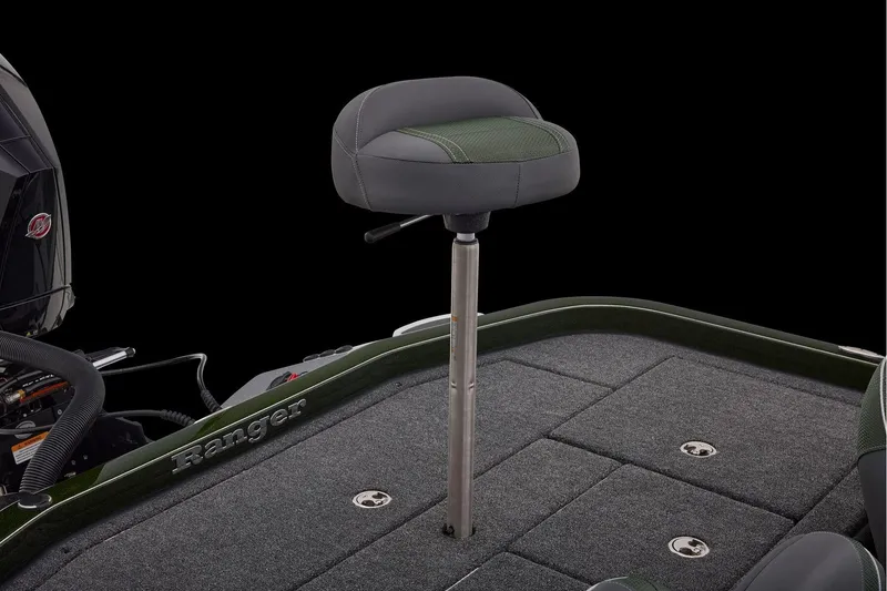 Slide: The Image of 2026 Ranger Z521 boat interior with open storage compartment and cushioned seat. - 59