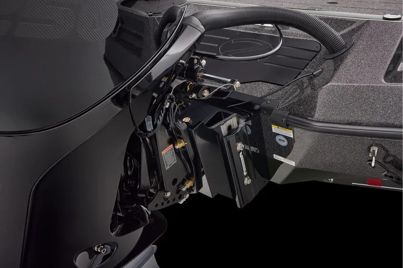 Slide: The Image of 2026 Ranger Z521 boat battery compartment with open hatch, showing multiple batteries and wiring. - 63