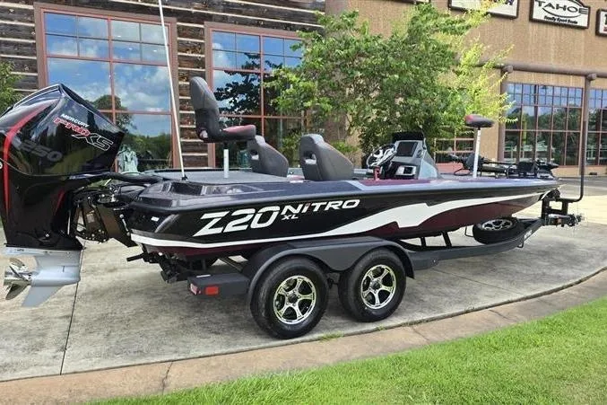 Slide: The Image of 2026 Nitro Z20 XL Pro fishing boat parked outdoors, showcasing sleek design and powerful engine. - 12
