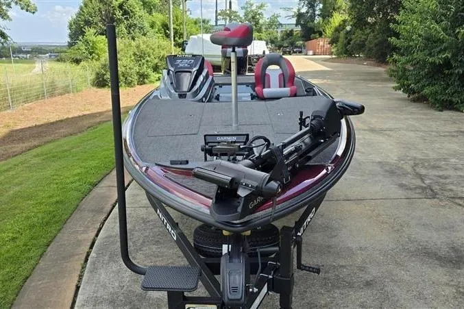 Slide: The Image of 2026 Nitro Z20 XL Pro fishing boat with advanced Garmin equipment on a driveway. - 11