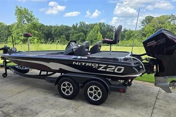 Slide: The Image of 2026 Nitro Z20 XL Pro boat on trailer, parked outdoors, under clear sky. - 13
