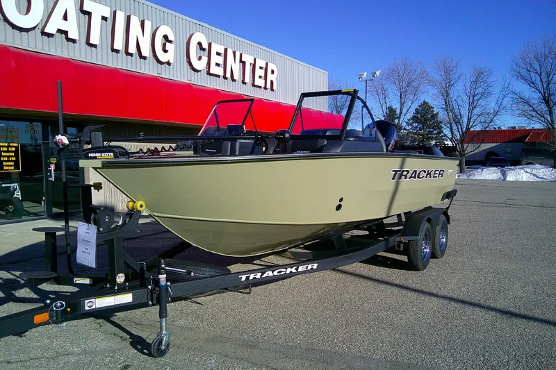Slide: The Image of 2026 Tracker Targa V-18 Combo boat on trailer outside boating center. - 81