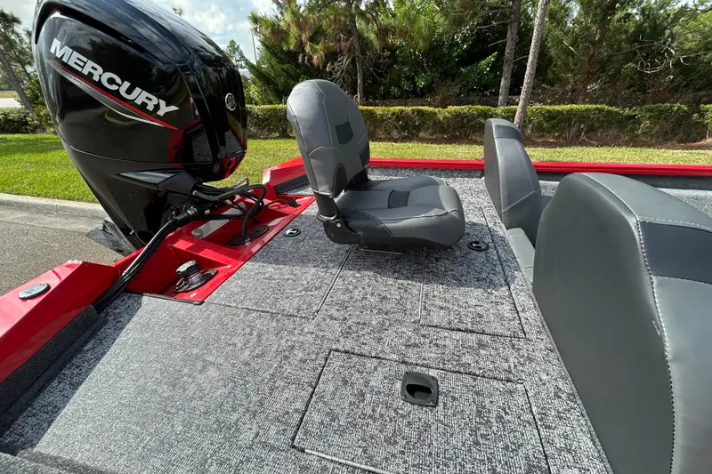Slide: The Image of 2026 Tracker Pro Team 175 boat with Mercury engine, featuring gray seating and carpeted deck. - 7