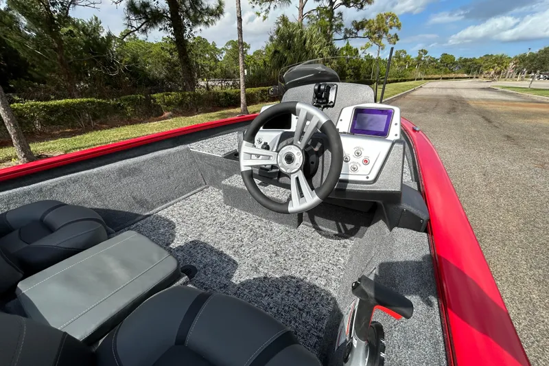 Slide: The Image of 2026 Tracker Pro Team 175 boat interior with steering wheel and control panel. - 8