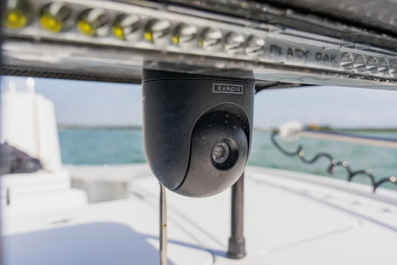 Slide: The Image of Security camera on 2026 Broadwater 25 Bay Cat boat, overlooking water. - 20