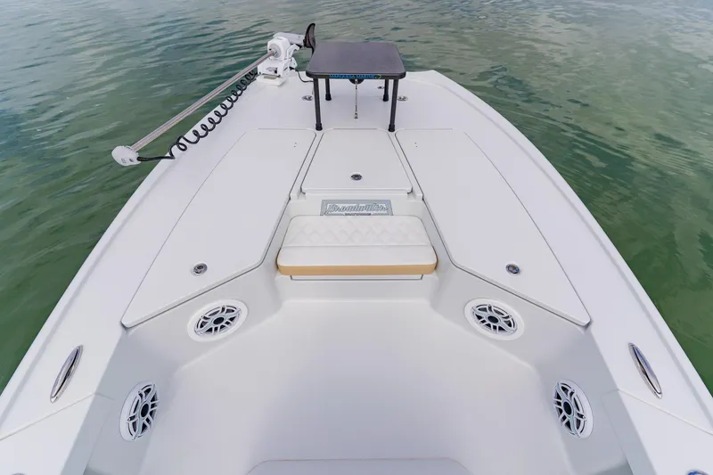 Slide: The Image of 2026 Broadwater 25 Bay Cat boat deck with seating and storage compartments. - 21
