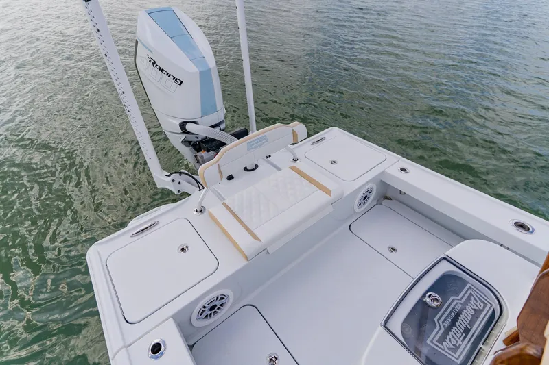 Slide: The Image of 2026 Broadwater 25 Bay Cat boat with powerful outboard motor on water. - 33