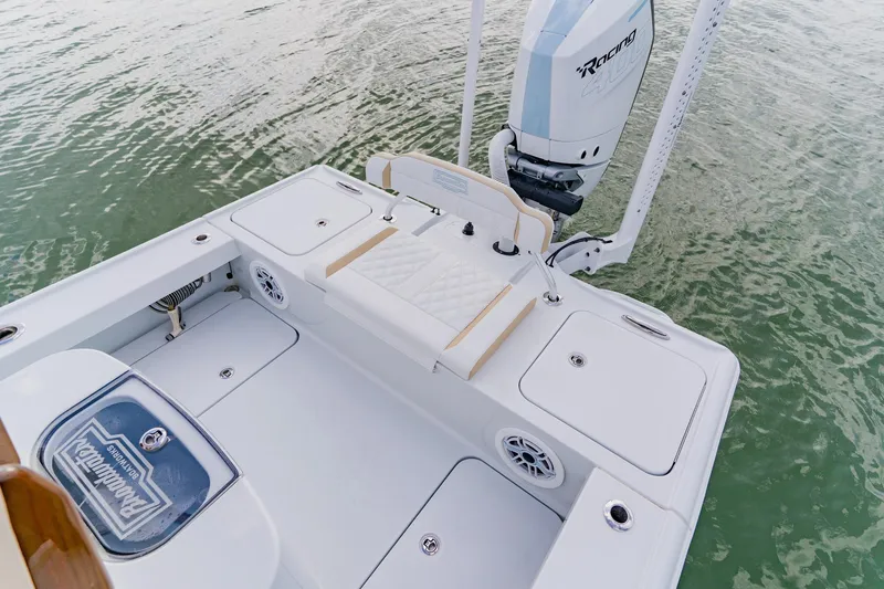 Slide: The Image of 2026 Broadwater 25 Bay Cat boat with sleek deck design and powerful engine on water. - 35