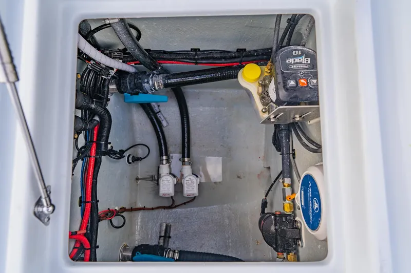 Slide: The Image of Bilge compartment of 2026 Broadwater 25 Bay Cat boat with wiring and pump system. - 40