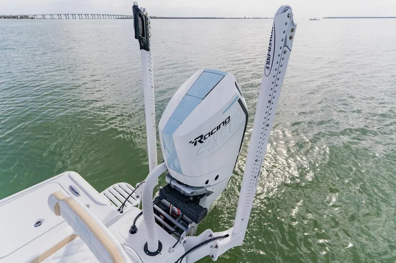 Slide: The Image of 2026 Broadwater 25 Bay Cat boat with powerful outboard motor on calm water. - 42