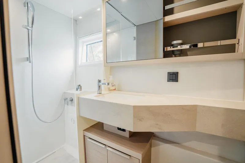 Slide: The Image of Modern bathroom in 2022 Lagoon 46 yacht with sleek fixtures and ample storage. - 106