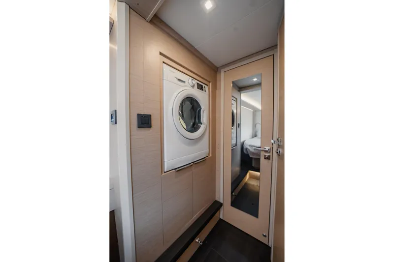 Slide: The Image of Interior of 2022 Lagoon 46 yacht with washer and mirrored door. - 111