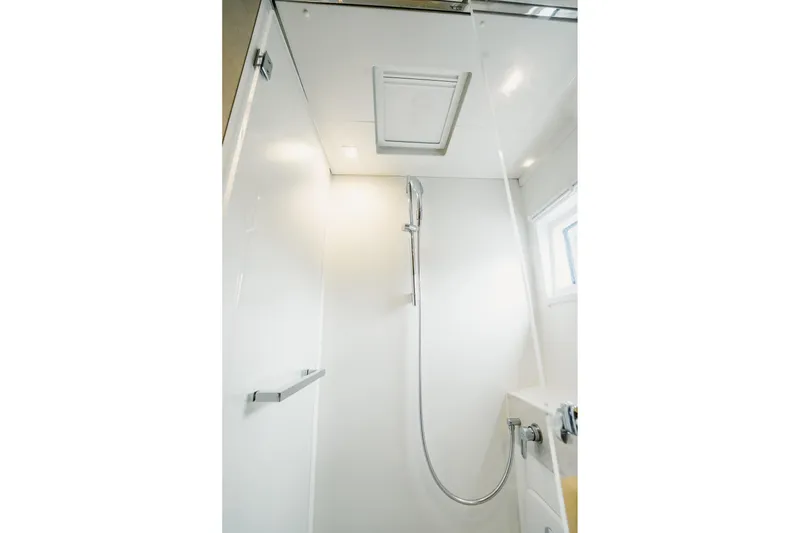Slide: The Image of Modern shower area in 2022 Lagoon 46 yacht, featuring sleek design and chrome fixtures. - 114