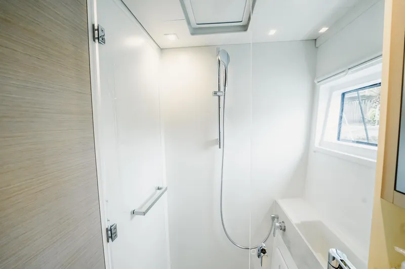 Slide: The Image of Modern shower area in 2022 Lagoon 46 yacht, featuring sleek design and natural lighting. - 115