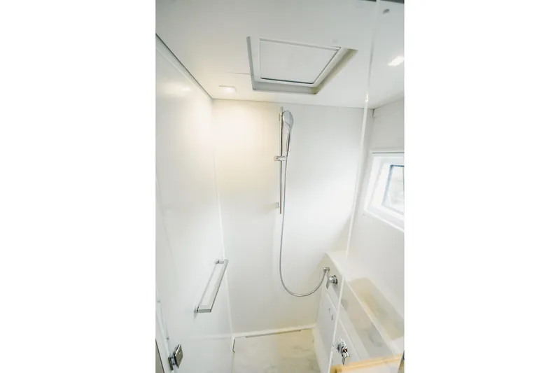Slide: The Image of Modern shower area in 2022 Lagoon 46 yacht, featuring sleek design and natural lighting. - 117