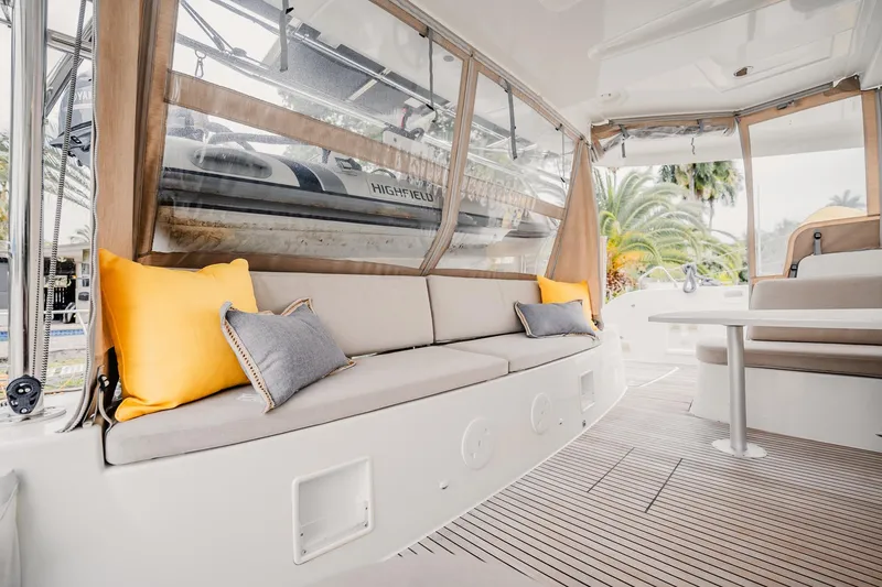 Slide: The Image of Luxurious Lagoon 46 catamaran interior with cozy seating and vibrant cushions, 2022 model. - 12