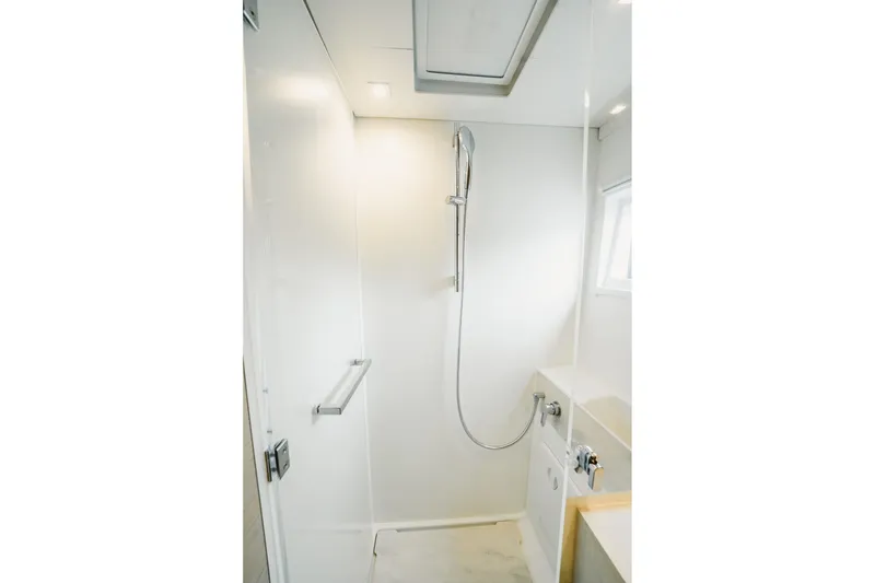 Slide: The Image of Modern shower area in 2022 Lagoon 46 yacht, featuring sleek design and fixtures. - 125