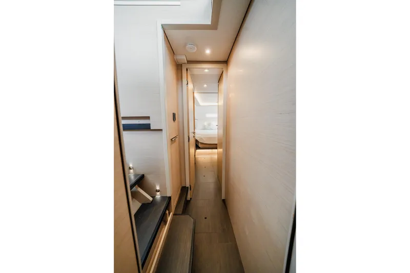 Slide: The Image of Modern interior hallway of 2022 Lagoon 46 yacht, featuring sleek design and ambient lighting. - 128