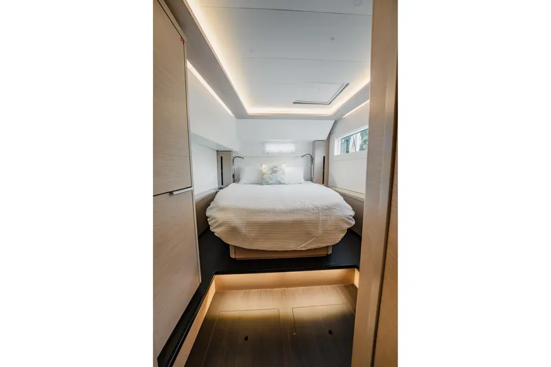 Slide: The Image of Luxurious interior cabin of 2022 Lagoon 46 yacht with modern lighting and cozy bed. - 129
