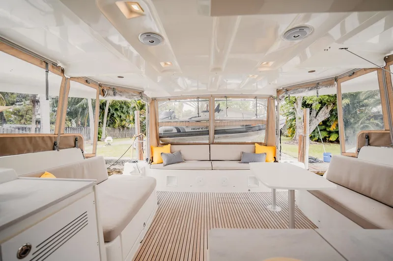 Slide: The Image of Spacious interior of 2022 Lagoon 46 catamaran with comfortable seating and modern design. - 13