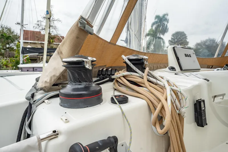 Slide: The Image of 2022 Lagoon 46 yacht deck with winches, ropes, and navigation equipment. - 137