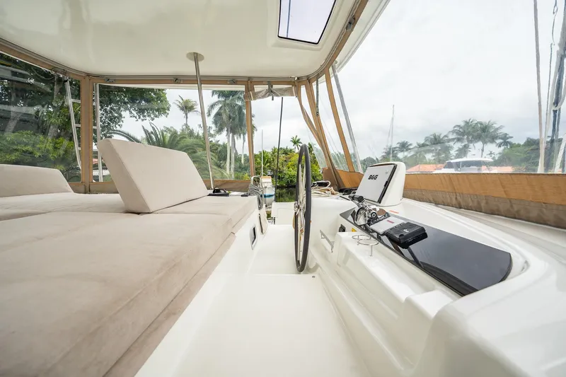 Slide: The Image of Luxurious interior of 2022 Lagoon 46 catamaran with plush seating and modern navigation equipment. - 143