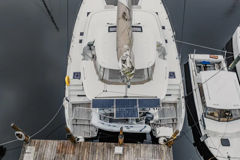 Slide: The Image of Aerial view of 2022 Lagoon 46 catamaran docked at marina. - 165