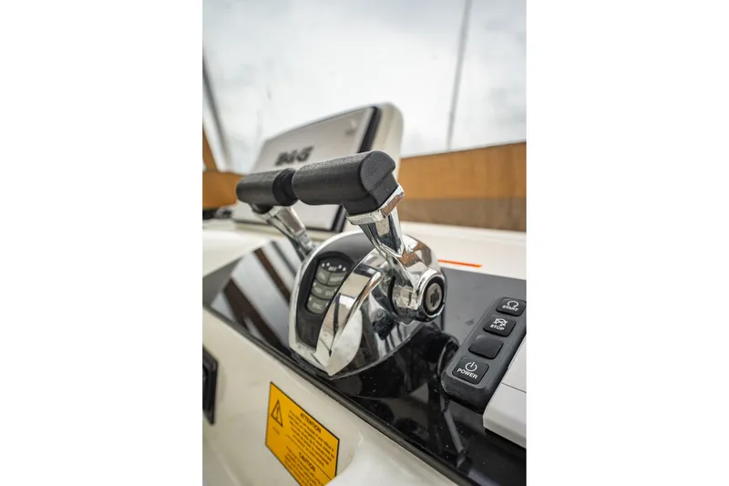 Slide: The Image of Close-up of 2022 Lagoon 46 yacht throttle controls and dashboard. - 166