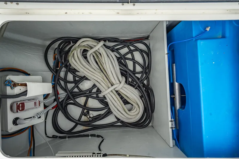 Slide: The Image of Storage compartment of 2022 Lagoon 46 yacht with ropes and cables. - 168
