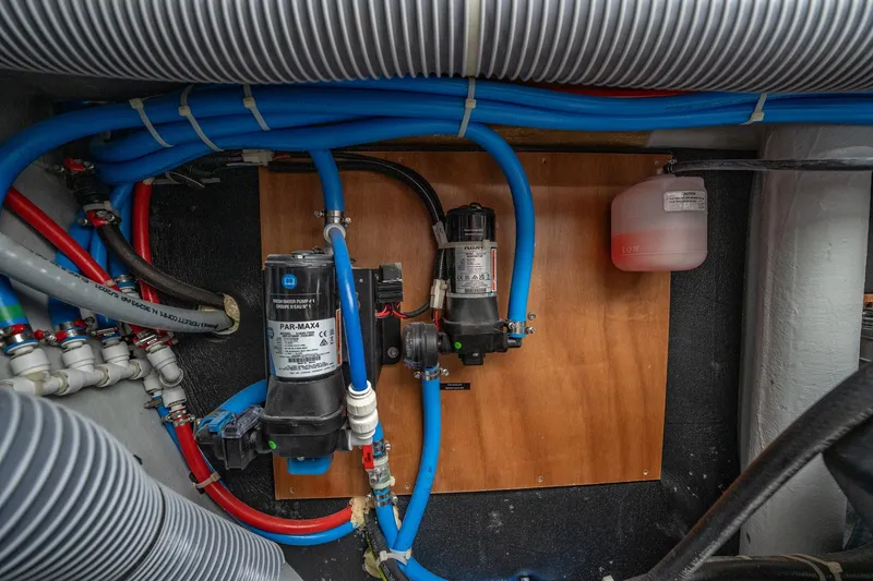 Slide: The Image of Engine room of 2022 Lagoon 46 yacht with plumbing and pump system. - 171