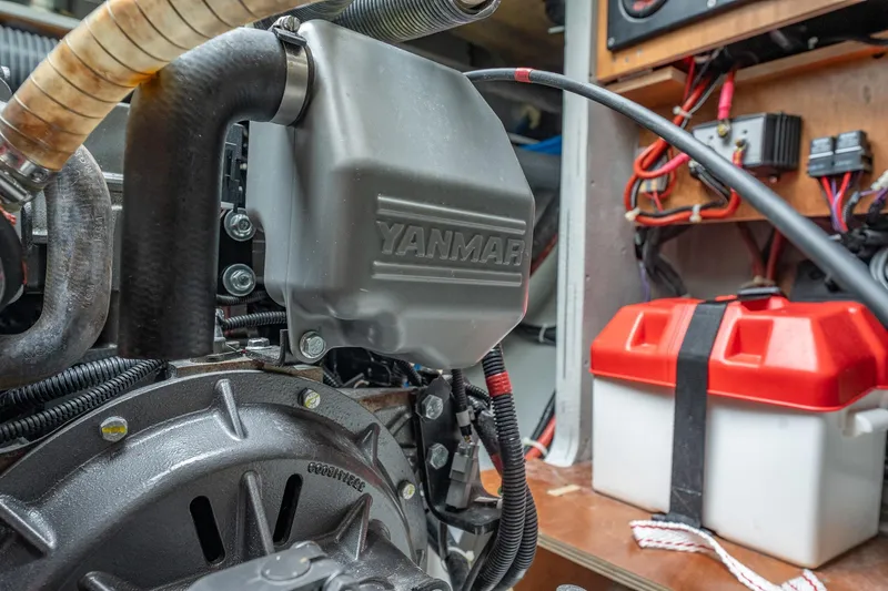 Slide: The Image of Engine compartment of 2022 Lagoon 46 catamaran with Yanmar components and battery box. - 175