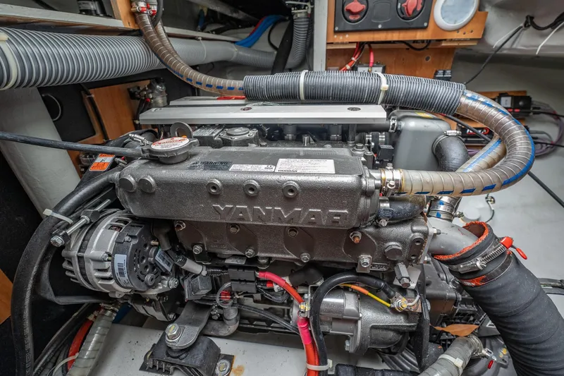 Slide: The Image of Engine compartment of a 2022 Lagoon 46 yacht, featuring a Yanmar engine. - 179