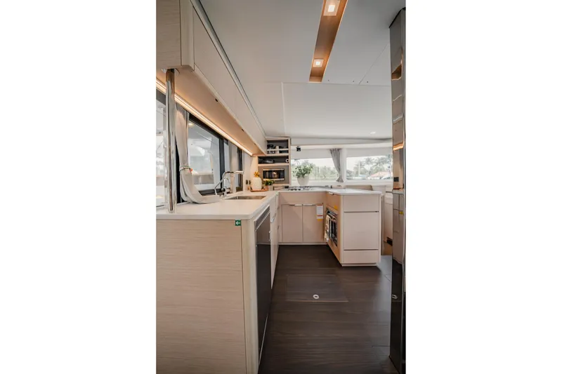 Slide: The Image of Modern interior of 2022 Lagoon 46 yacht with sleek kitchen design. - 18