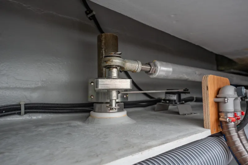 Slide: The Image of Interior mechanical components of a 2022 Lagoon 46 yacht, featuring pipes and fittings. - 180