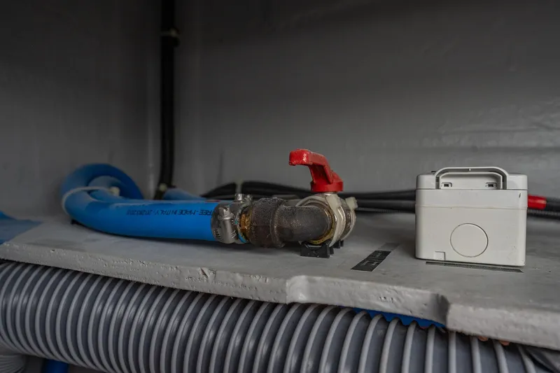 Slide: The Image of Plumbing and electrical components inside a 2022 Lagoon 46 yacht. - 181