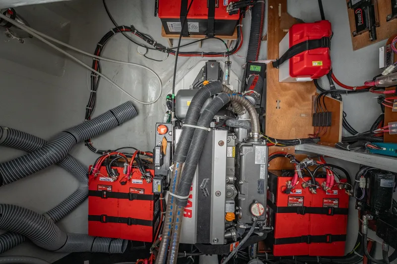 Slide: The Image of Engine room of 2022 Lagoon 46 catamaran with batteries and wiring. - 184