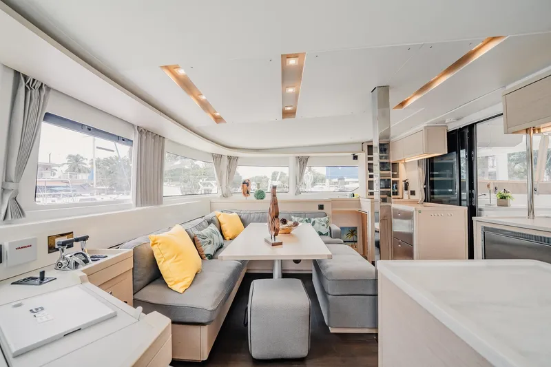 Slide: The Image of Luxurious interior of 2022 Lagoon 46 yacht with modern furnishings and ample natural light. - 23