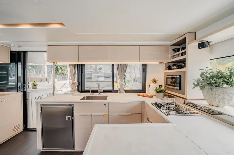 Slide: The Image of Modern kitchen interior of 2022 Lagoon 46 yacht with sleek design and appliances. - 25