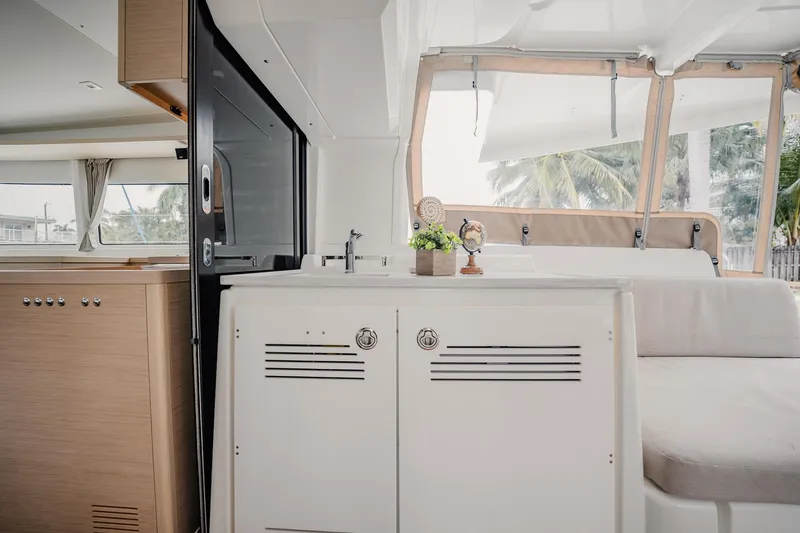 Slide: The Image of Interior of 2022 Lagoon 46 catamaran with modern design and comfortable seating. - 33