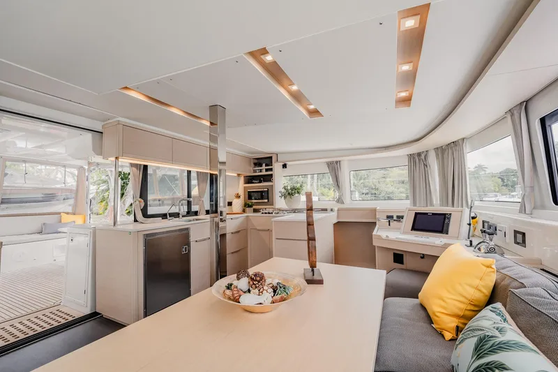 Slide: The Image of Luxurious interior of 2022 Lagoon 46 catamaran with modern kitchen and cozy seating area. - 34