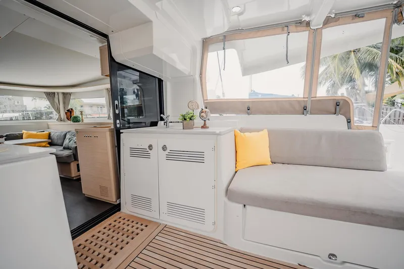 Slide: The Image of Interior of 2022 Lagoon 46 catamaran with modern seating and decor. - 35