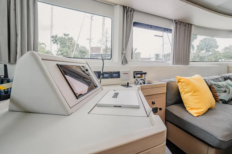 Slide: The Image of Interior of 2022 Lagoon 46 yacht with modern navigation equipment and cozy seating area. - 36
