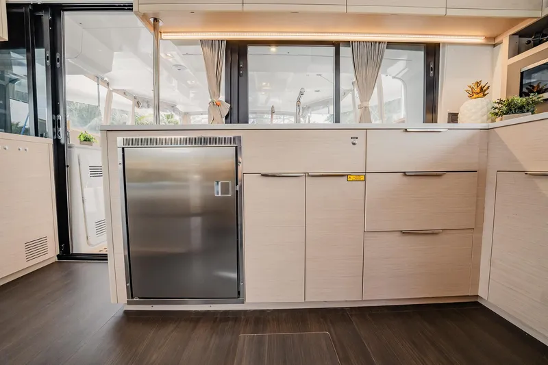Slide: The Image of Modern kitchen interior of 2022 Lagoon 46 yacht with sleek cabinetry and stainless steel appliances. - 38