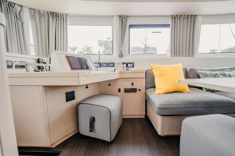 Slide: The Image of Interior of 2022 Lagoon 46 yacht with modern seating and navigation area. - 39