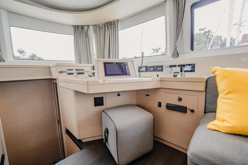Slide: The Image of Interior of 2022 Lagoon 46 yacht with modern helm station and cozy seating. - 40