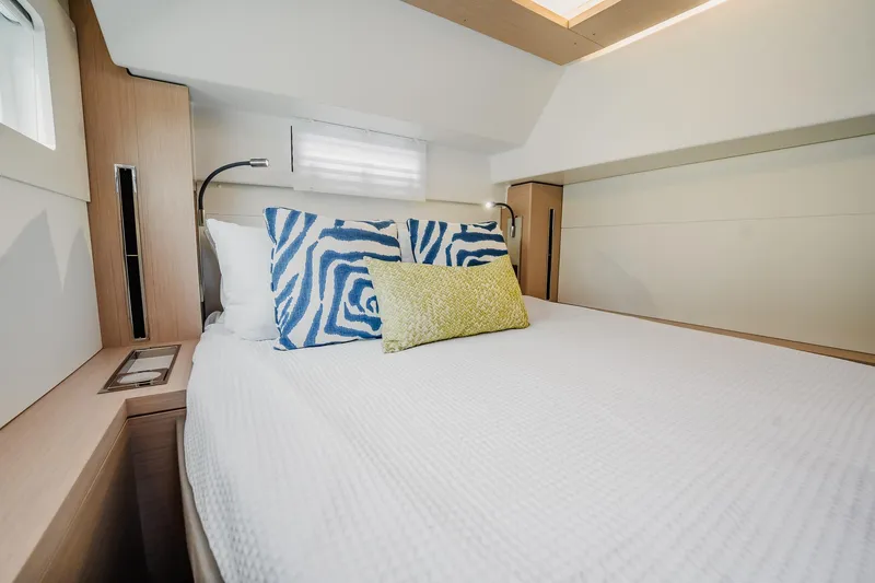 Slide: The Image of Luxurious bedroom interior of 2022 Lagoon 46 yacht with stylish bedding. - 43