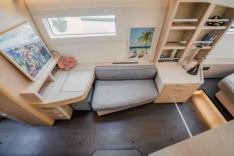 Slide: The Image of Luxurious interior of 2022 Lagoon 46 yacht with modern decor and cozy seating area. - 44