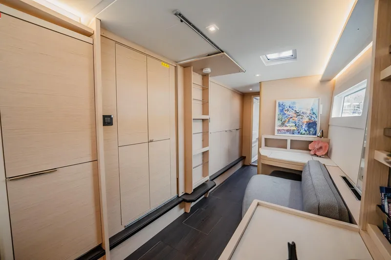 Slide: The Image of Interior of 2022 Lagoon 46 yacht, featuring modern design and light wood finishes. - 46