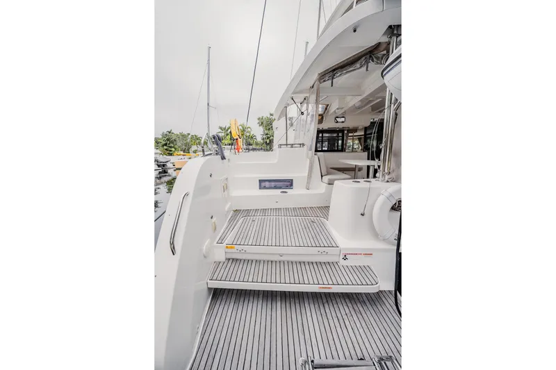 Slide: The Image of 2022 Lagoon 46 yacht deck with modern design and spacious seating area. - 51