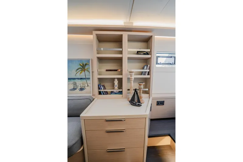 Slide: The Image of Interior of 2022 Lagoon 46 yacht with modern shelving and nautical decor. - 52
